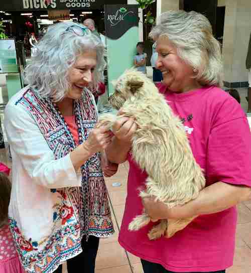 Lost Paws Rescue of Texas - Founder Yvette Garza, right, with Happy Adopter